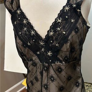 Black lacy blouse- v-neck sleeveless ladies top. Size 8.